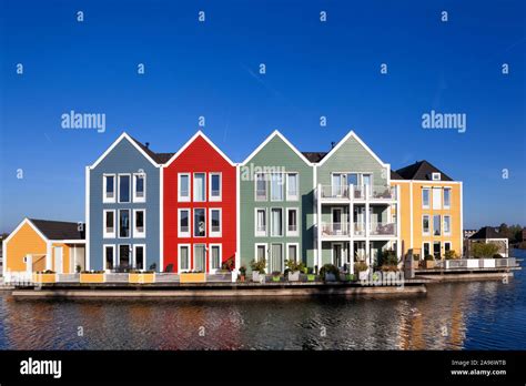 Colorful Houses Surrounded By Water In Houten In The Netherlands Stock