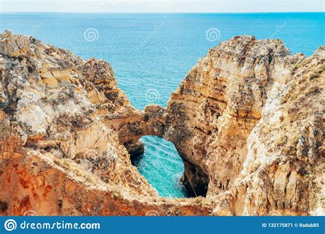Ocean Landscape With Rocks And Cliffs At Lagos Bay Coast In Portugal