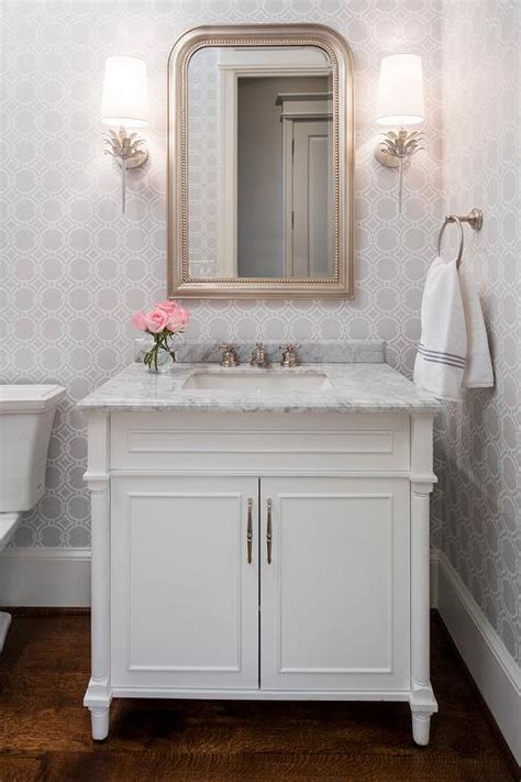 Powder rooms are as popular as ever because space is tight, but desire for style is unquenchable. Gray Powder Room with Silver Leaf Beaded Mirror - Transitional - Bathroom