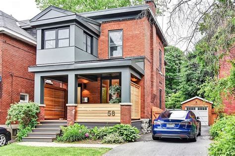 Painting a brick home exterior is a fast and affordable way to modernise a dated facade and add value to this 1960s red brick bungalow was refreshed with a lick of black paint on the exterior. Modern porch on a red brick house (With images) | Red ...