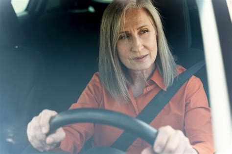 Premium Photo Sad Tired Senior Woman Driving A Car Stuck In Traffic