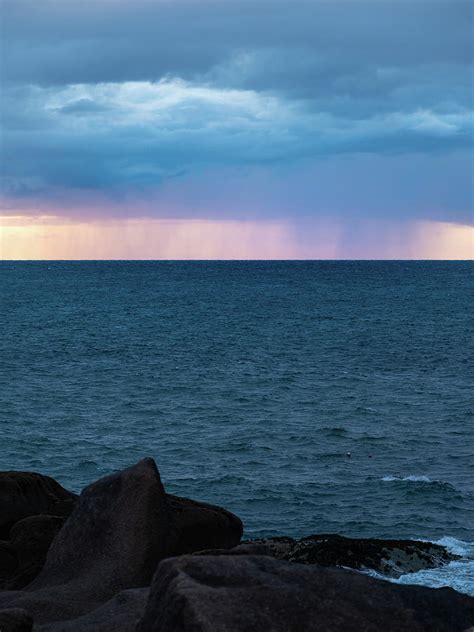 Rain Clouds Over The Sea During Sunset Photograph By Stefan Rotter