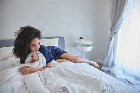 Pleased Brunette Woman Lying On The Bed Stock Photo Image Of