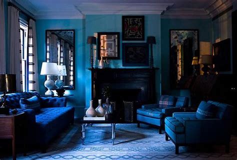 A Living Room Filled With Blue Couches And Chairs