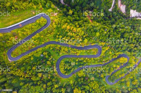 Aerial View Of Winding Road On Mountain In Autumn Stock
