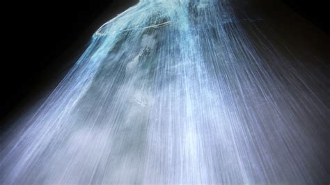 Digital Waterfall Projected On A Satellite Gives The Illusion Of