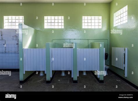 Male Toilet Cubicles In A Prison Bathroom On Robben Island Stock Photo