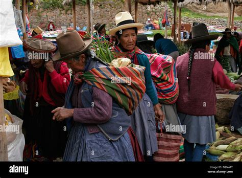 Quechua Women On Traditional Indigenous Sunday Market In Chinchero Near