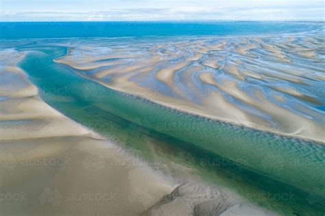 Image Of Aerial View Of Creek And Sandbar Patterns In Shallow Blue