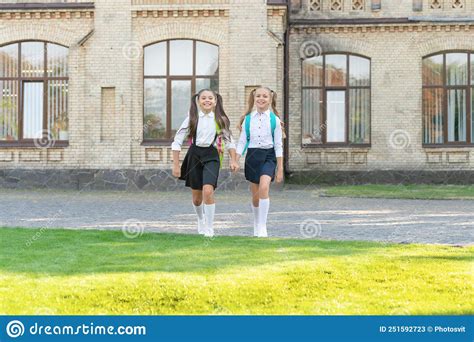 Two Teen Girls In Uniform Walking Together Outdoor Stock Image Image