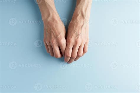 Hard Working Hands With Protruding Veins On Blue Background 7280969