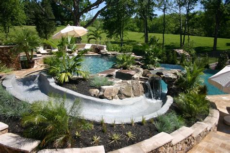 Tropical Swimming Pool With Pathway Exterior Stone Floors Fence Pool