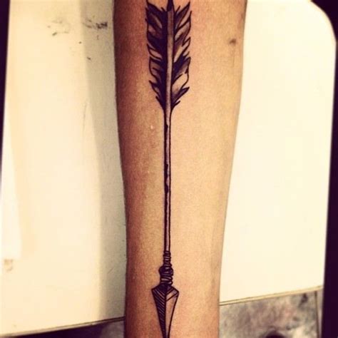 An Arrow Tattoo On The Leg