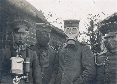 German Soldiers Wearing Four Different Types Of Gas Masks That Were
