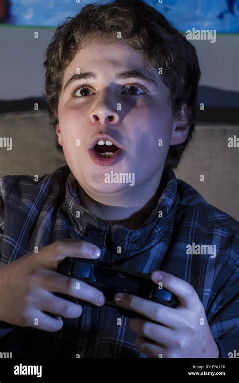 Happy Boy With Joystick Playing Computer Game At Home Stock Photo Alamy