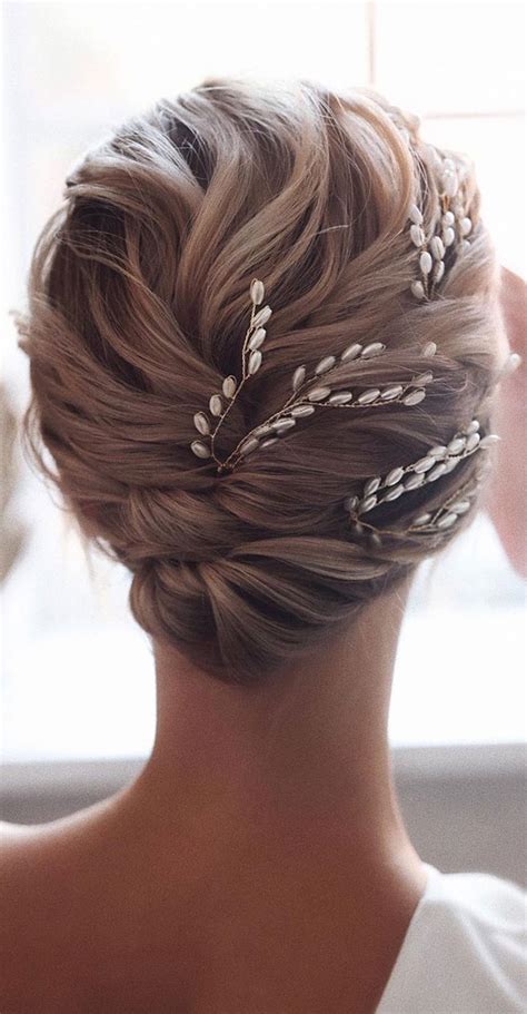 Half up half down hair is a timeless wedding look and one of the most popular wedding hairstyles for brides on their big day. Romantic Wedding Updos That You'll Just Adore, Updo Hairstyles