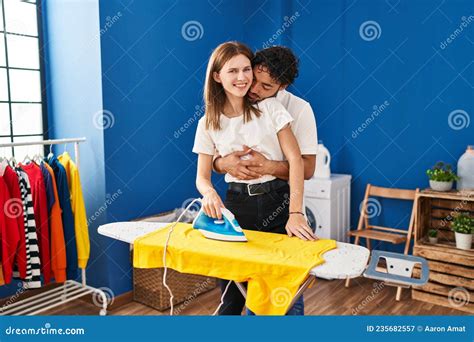 Man And Woman Couple Hugging Each Other Ironing At Laundry Room Stock Image Image Of