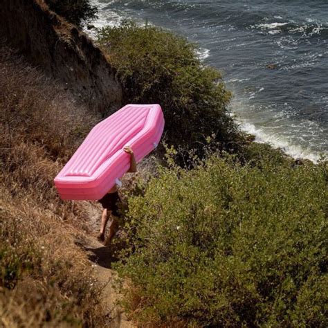 A Pink Coffin Pool Float With Lid 8 Pics