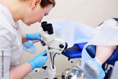 The Gynecologist Examines The Patient On A Gynecological Chair And