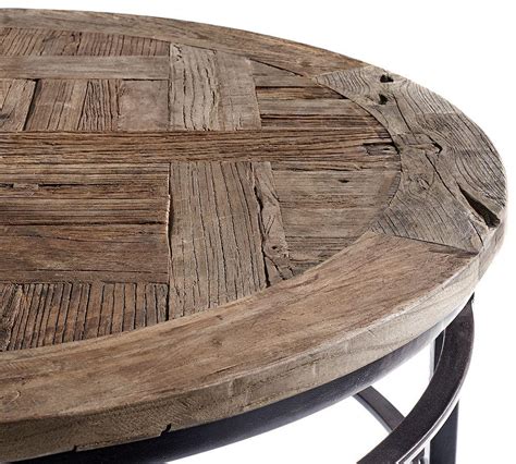 Pismo's plank top is crafted of reclaimed wood, its uneven edges and distressed look celebrating its natural character. Parquet Round Coffee Table| Pottery Barn