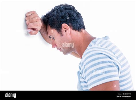 Sad Man Leaning His Head Against A Wall Stock Photo Alamy