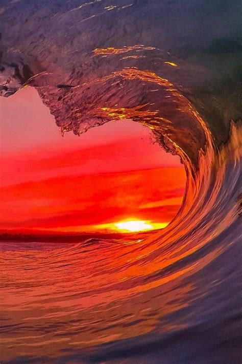 Flaming Red Sunset Seen Through The Pike Of A Wave Stunning Beautiful