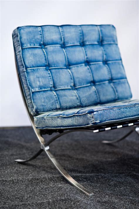 Icon of modernism, the barcelona chair has been in production for almost 80 years since, with very few changes distinguishing it from the first version. Famous Barcelona Chair In Blue Jeans Color Stock Image ...