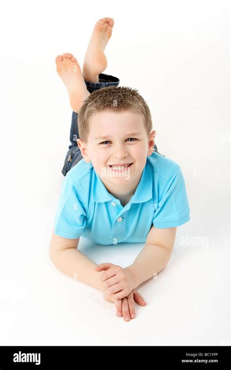 Young Boy Lying On Stomach In Studio Stock Photo Alamy