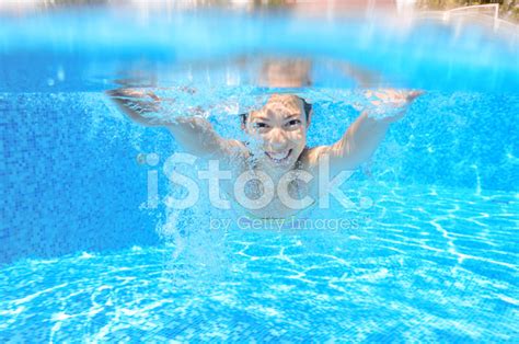 Happy Active Underwater Child Swims In Pool Stock Photo Royalty Free