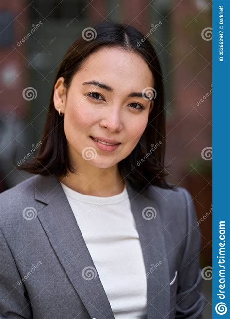 Young Confident Elegant Asian Business Woman Vertical Headshot
