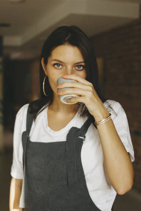 Young Attractive Girl In Casual Clothes Drinking Coffee In Cafe Stock