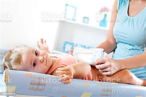 Mother Changing Baby Girl Diaper Stock Photo Download Image Now 35