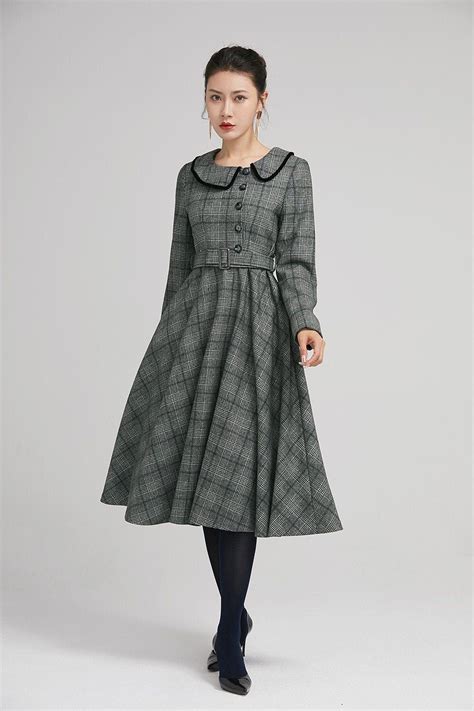 Simple With Its Pleated Skirt And Grayscale Plaid Pattern This