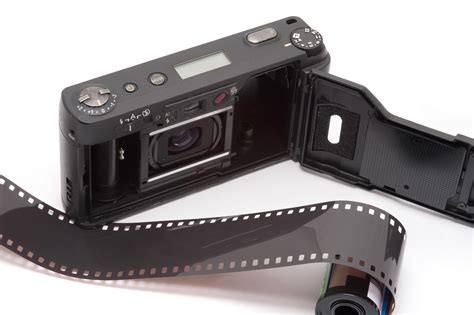 Free Stock Photo 12148 Exposed Roll Of Film Next To Pocket Camera