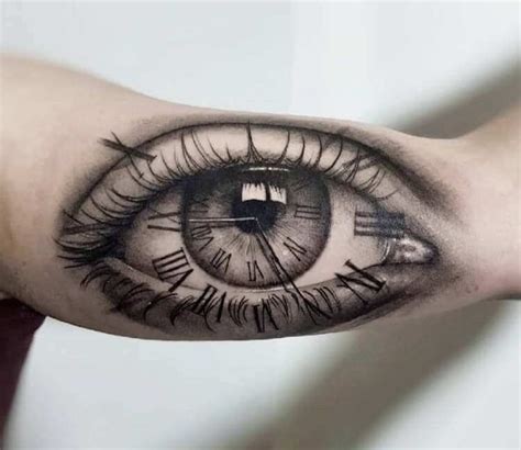 An Eye Tattoo On The Arm With Some Sort Of Clock In Its Center