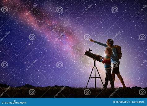 Man And Child Looking At Stars Through Telescope Stock Photo Image Of