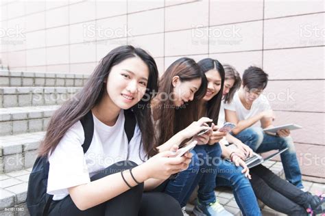 Group Of Happy Teen High School Students Outdoors Stock Photo