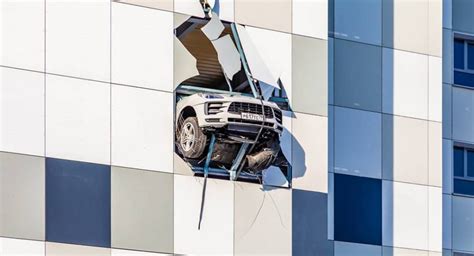 Porsche Macan Almost Crashes Out Of Multistory Parking Lot In Russia