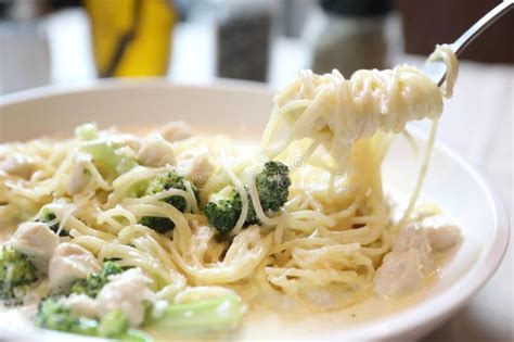 Alfredo Spaghetti Broccoli Chicken White Sauce In Restaurant Background