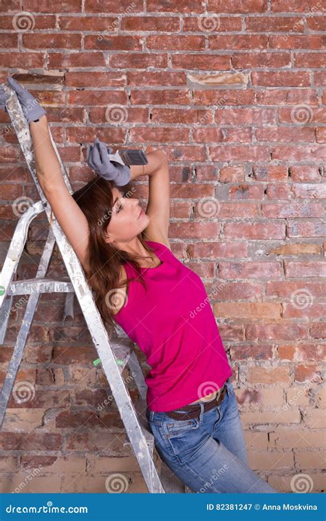 Woman Painter On A Ladder Near Brick Wall Stock Image Image Of