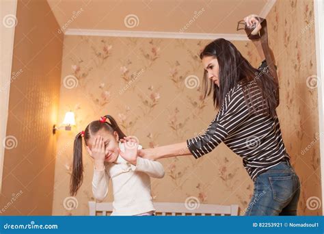 mother hit her ldaughter with belt stock image image of home holding 82253921