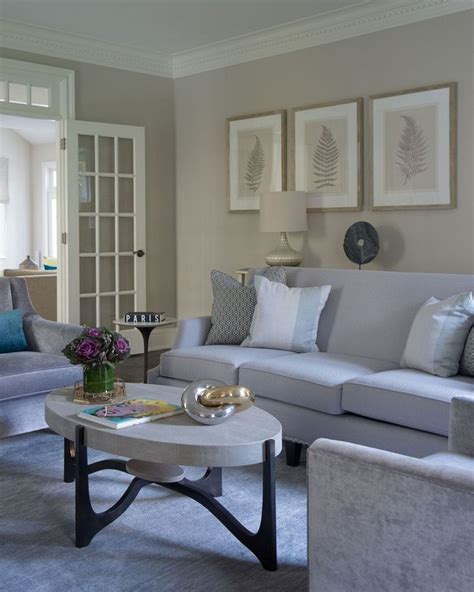 In this space, the largest block of color comes from a graphite gray sofa, which. Relax - Living Room beige walls, white trim, soft blue ...