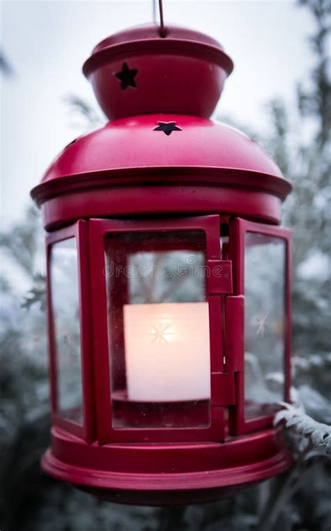 Outdoor Red Christmas Lantern With Snow Covered Trees Stock Photo