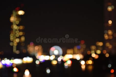 Blurry Light Of Building On River Background And Texture Stock Photo