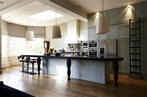 The original island was moved from the wall and turned into a large 3′ x 8′ island, which accommodates both storage for toys and seating. David Dangerous: Modern Victorian House Kitchen