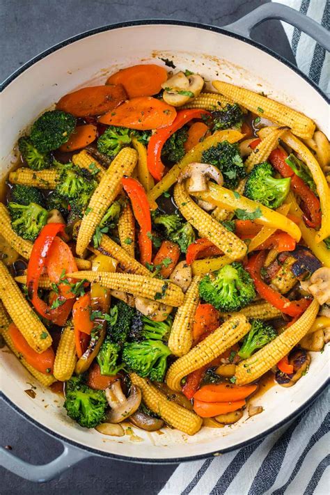 A delicious peanut stir fry sauce compliments fragrant vegetables and soft noodles in this quick and simple vegan dish. EASY Vegetable Stir Fry Recipe - NatashasKitchen.com