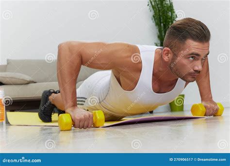 Man Sports Doing Exercises Push Ups On Dumbbells Pumped Up Man Fitness
