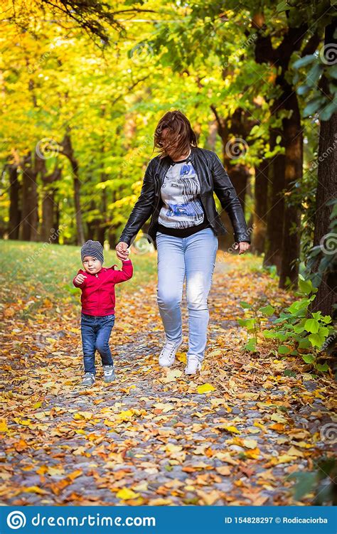 Two Years Old Toddler Have Fun Outdoor In Autumn Park Stock Image