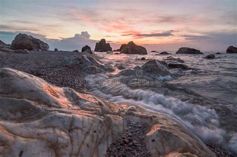 Sunset Golden Hour Rocks In The Beach Sea Horizon Stock Photo Image