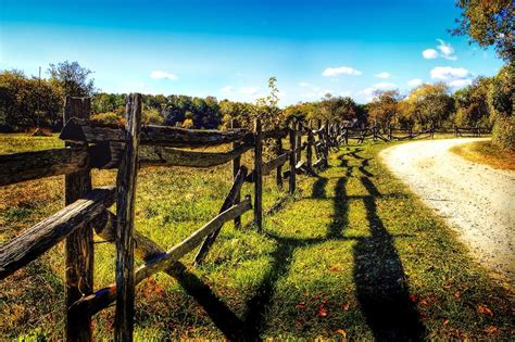 Country Road Along A Wooden Fence Free Image Download